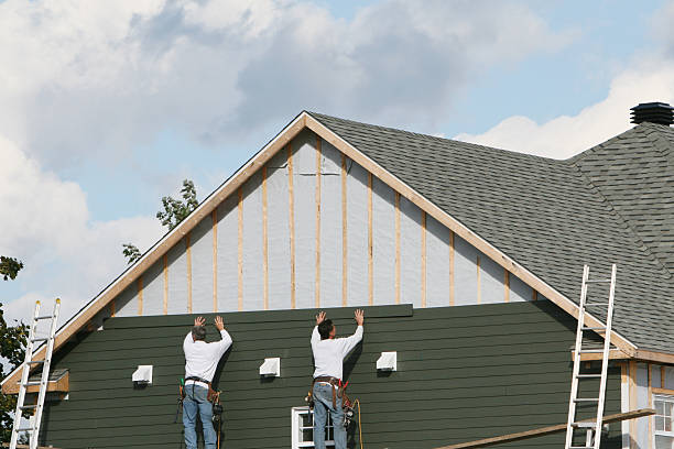 Professional Storm Damage Siding Repair technician working in Glen Cove, NY